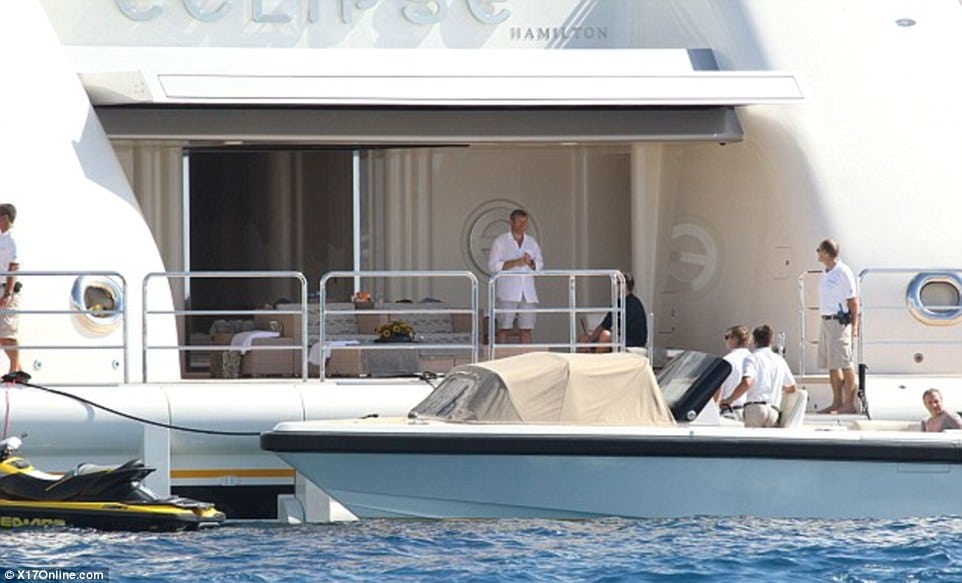 Roman Abramovich pictured somewhere in British water relaxing on his Eclipse Super Yacht with several friends | Photo credit: Daily Mail