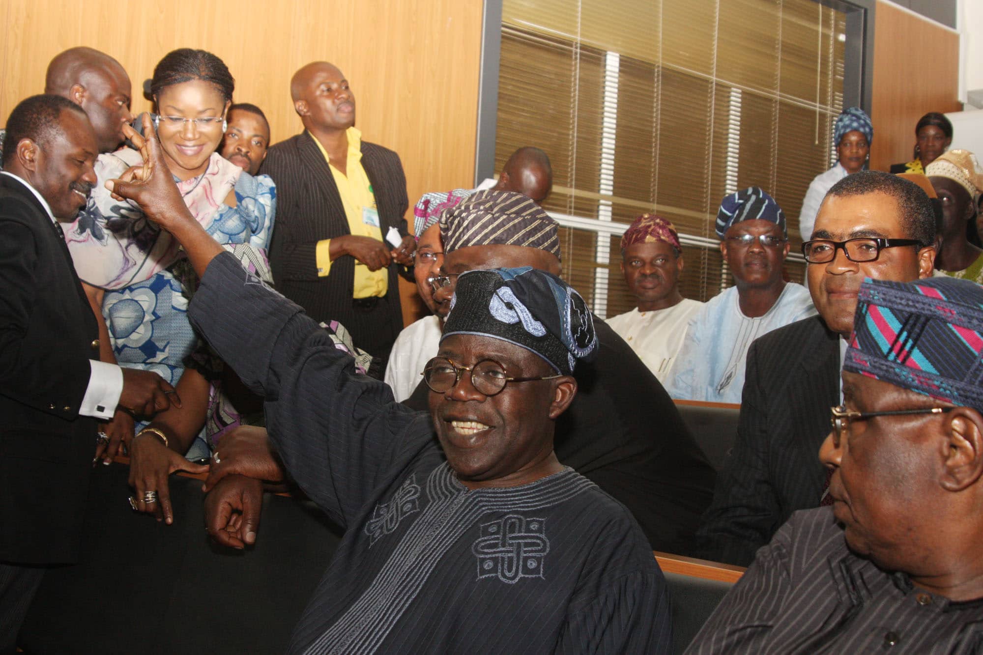 Bola Ahmed Tinubu with friends and followers at the Code of Conduct Tribunal in 2011