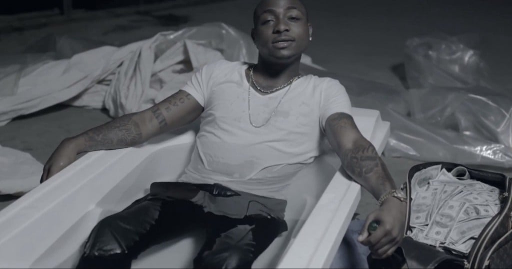 Davido chilling with loads of dollars