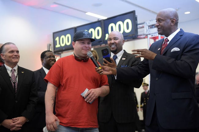 Passenger Larry Kendrick, middle, speaks next to Hartsfield-Jackson Atlanta International Airport Manager Miguel Southwell, right, during the ceremony |Photo credit: ifpress.com