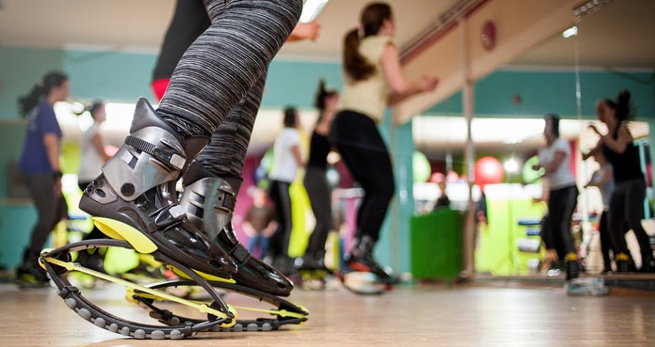 group of people doing exercises with kangoo shoes